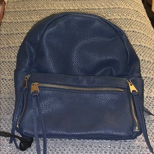 Multiple pocket blue faux leather backpack